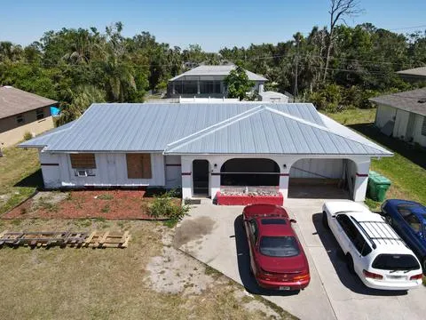 Shingle To Metal Roof Replacement