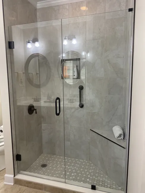 Two Panel Frameless Glass Shower Enclosure with Matte Black Hinges and Door handle