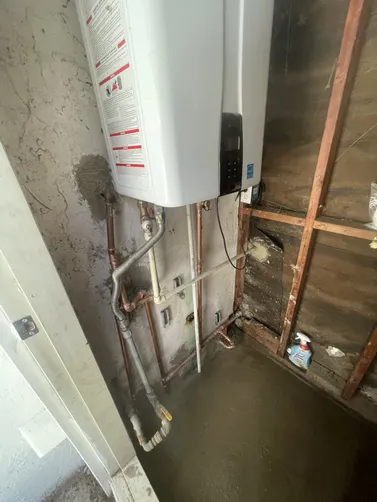 photo at Walnut Creek, CA on Apr 21, 2026: A water line leak was identified at the T&P valve on the tankless water heater, causing potential d