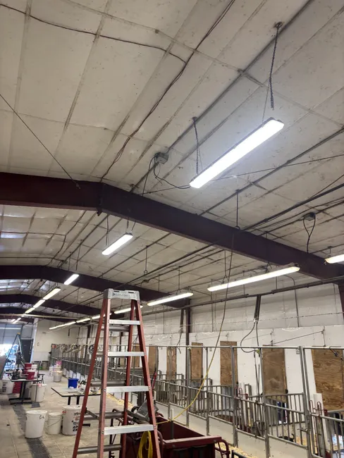 Enhanced visibility for the pig barn by replacing six old lights with customer-supplied fixtures.
