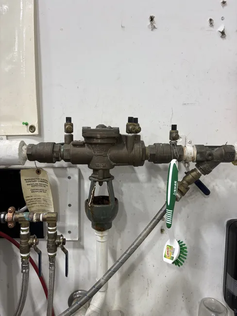A persistent pipe leak led to the replacement of a laundry tub faucet and the installation of a backflow device, ensuring optimal water flow and preventing future issues.