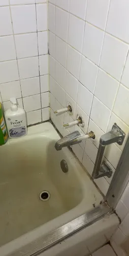 photo at Spring, TX on Dec 27, 2025: A leak was identified in the three-handle faucet of the second-floor shower bath tub, along with an