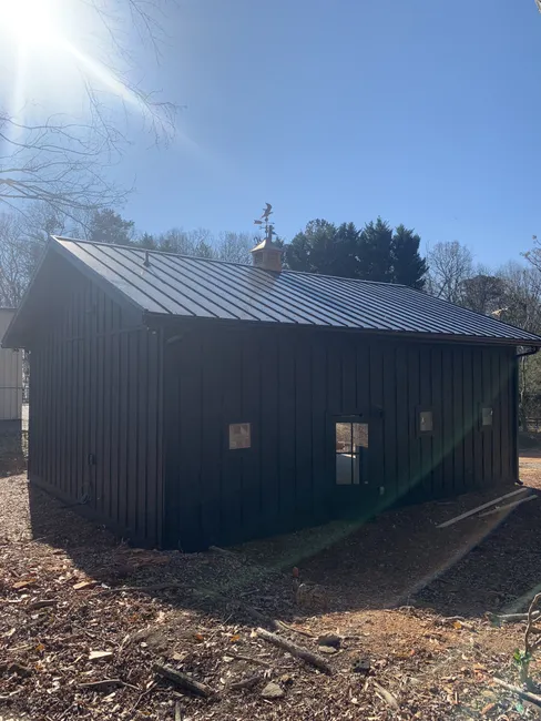 Kristy's barn received a refreshing upgrade with a new standing seam metal roof, complete gutters, and downspouts.
