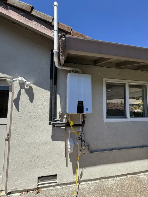 We upgraded the home's plumbing by installing a new 240A tankless water heater for efficient hot water.