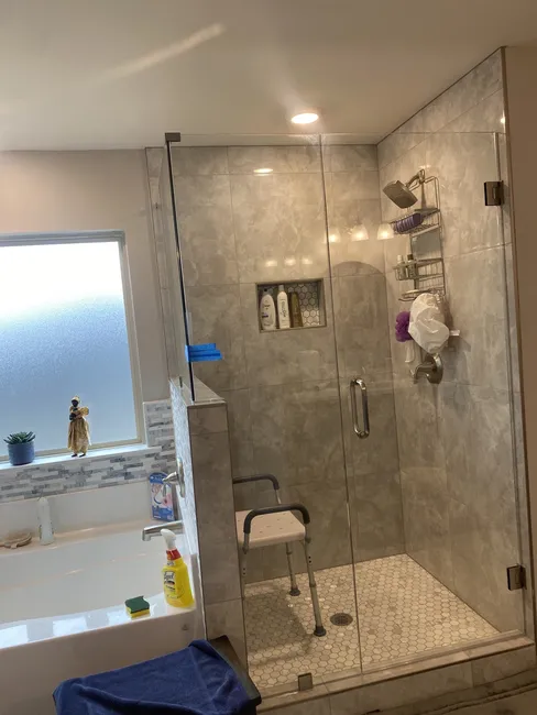 Three Panel Frameless Glass Shower Enclosure with Brushed Gold Hinges, Clips, and Handle