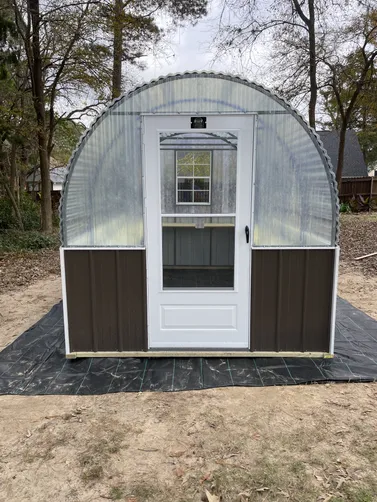 photo at Bullard, TX on Dec 12, 2025: 8x12 greenhouse with burnished slate wainscotWelded frame with solid commercial grade corrugated f