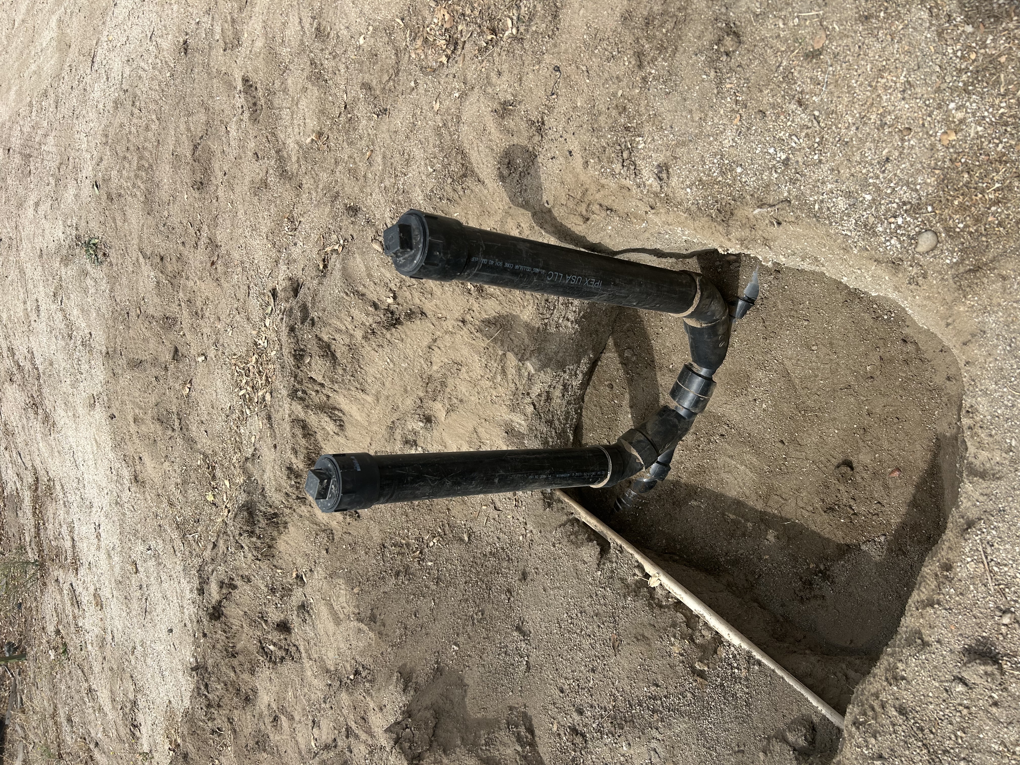 New double sweep sewer clean-outs installed in the ground