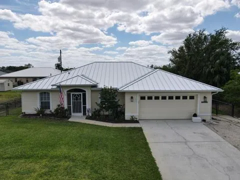 Shingle To Metal Roof Replacement With New Gutters