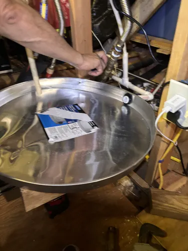 photo at Spring, TX on Sep 19, 2025: A leaking heat exchanger prompted us to inspect the existing tankless water heater, which was still