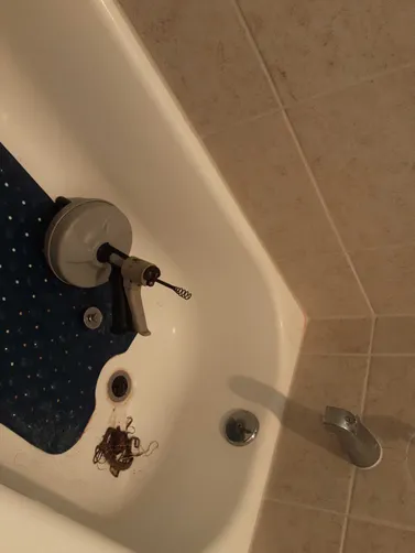 photo at Conroe, TX on Nov 11, 2025: A clogged bathtub in the guest bathroom was causing issues, preventing proper drainage. We disconne