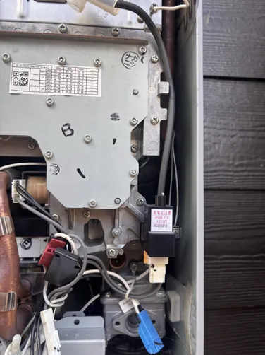 photo at Houston, TX on Nov 12, 2025: A broken igniter coil was diagnosed as the issue with the water heater located outside. We identifi