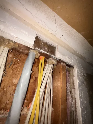 Installed duct seal in an LB leading into the crawlspace and ensured drill holes through the header coming down into the garage from the attic were at the proper inch & a quarter depth for inspection on a new 20A dedicated extended circuit run.