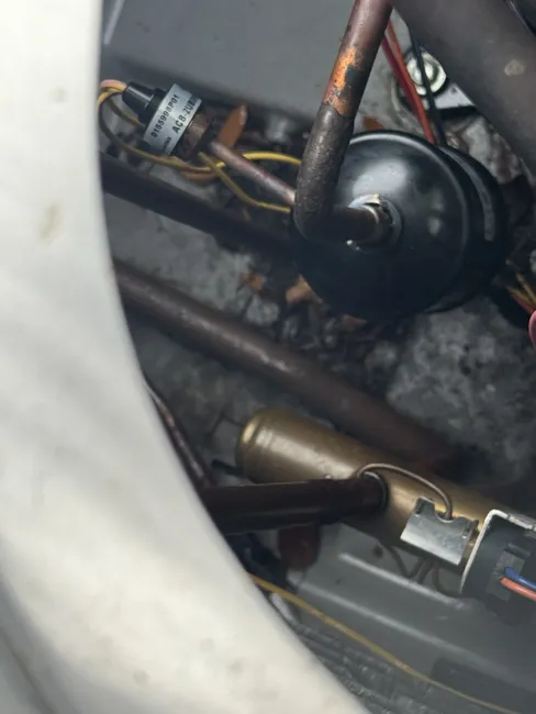 Addressed buildup in the upstairs AC unit with a thorough cleaning and replaced the condenser capacitor for optimal performance.