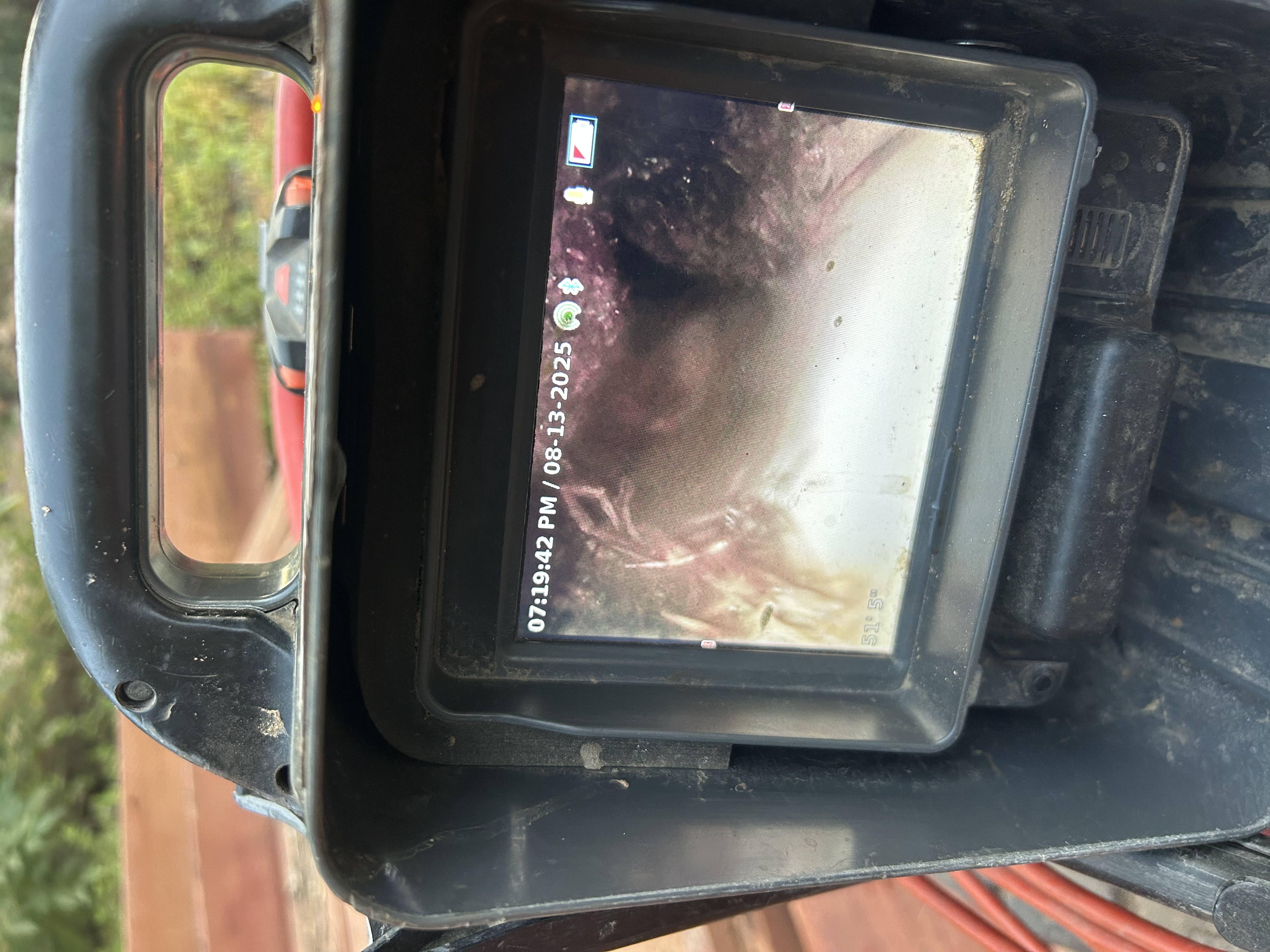 Sewer camera monitor showing tree roots inside the main line