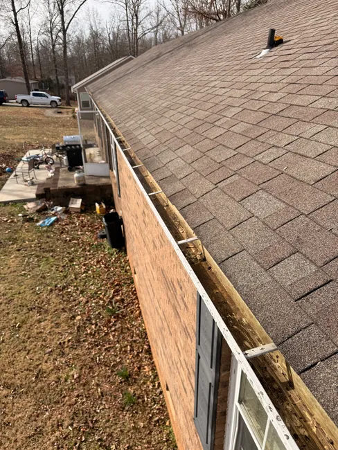 At a residence in Statesville, we refreshed the gutters by removing debris, ensuring optimal water flow for heavy rains.