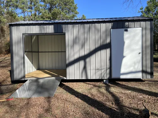 photo at Magnolia, AR on Dec 31, 2025: 10x20 gable storage building in charcoal with black trimIncludes- welded steel frame, solid 3/4