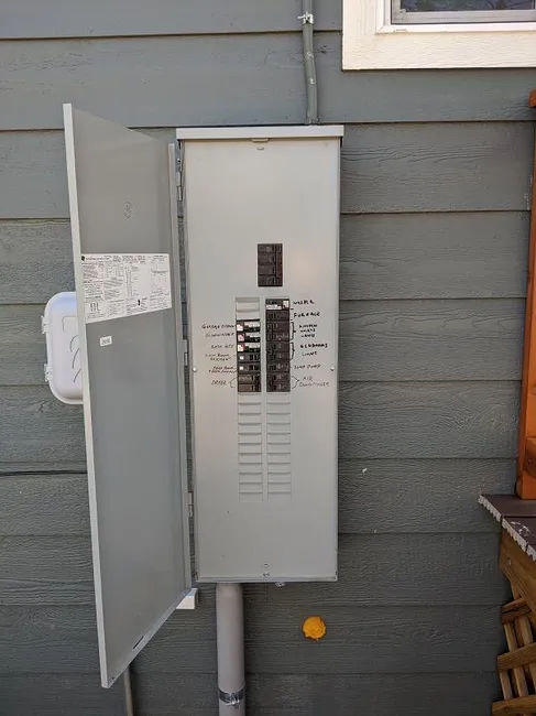 We upgraded the home's electrical system by installing a new main breaker panel and relocating the sub panel for better safety and accessibility.