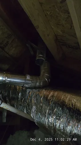 photo at Brian Head, UT on Dec 04, 2025: A furnace issue was identified in the attic above the garage, where the B-vent had become disconnec