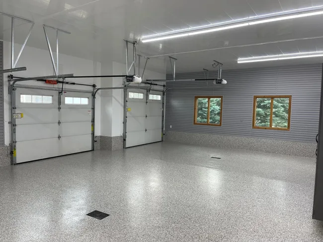 Old fluorescent fixtures in the garage were replaced with energy-efficient LED lights, enhancing brightness and reducing pests.