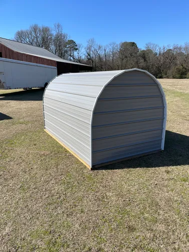 photo at Maud, TX on Jan 20, 2026: 6x10open front shelter with welded steel frame, 40 year max rib siding in -Pewter gray-treated 2x4