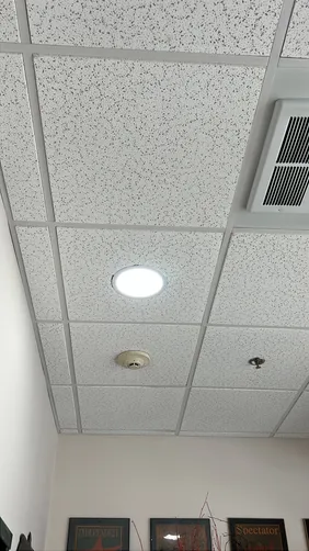 We removed nine old can lights and three old Emergency Lights with large inverter batteries and replaced with nine wafer lights and three direct wired Emergency Lights. Three of the lights are above fourteen feet high.