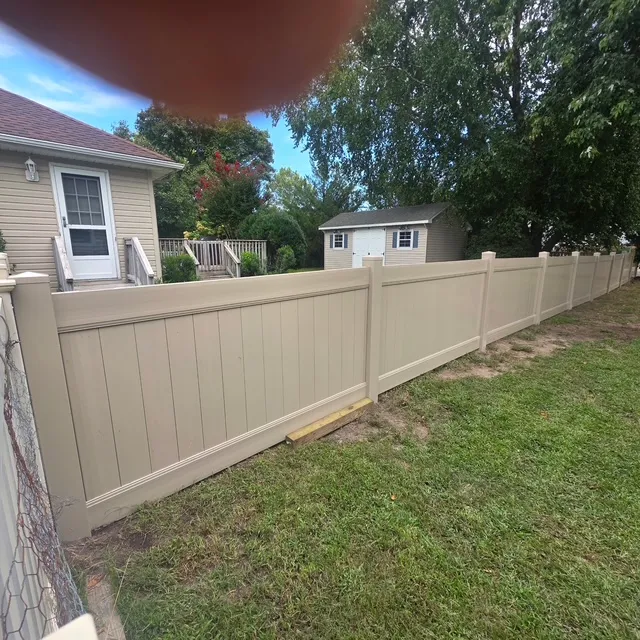 To enhance backyard privacy at a property in OceanView, DE, we installed 72 feet of durable 48-inch adobe vinyl fencing, ensuring stability with 36-inch deep concrete post settings.