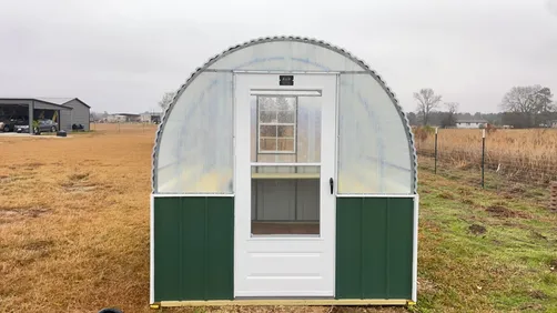 photo at Winona, TX on Jan 23, 2026: 8x10 Greenhouse with window, storm door, treated shelving, treated base20 year corrugated fibergla