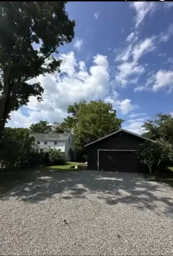 photo at Amenia, NY on Aug 25, 2024: A dying ash tree was posing a risk over the customer’s garage, while an overhanging maple tree thre
