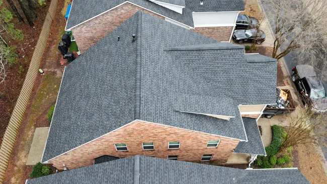 A well-worn roof was replaced with a new GAF Timberline HDZ system in Charcoal, enhancing durability and style.