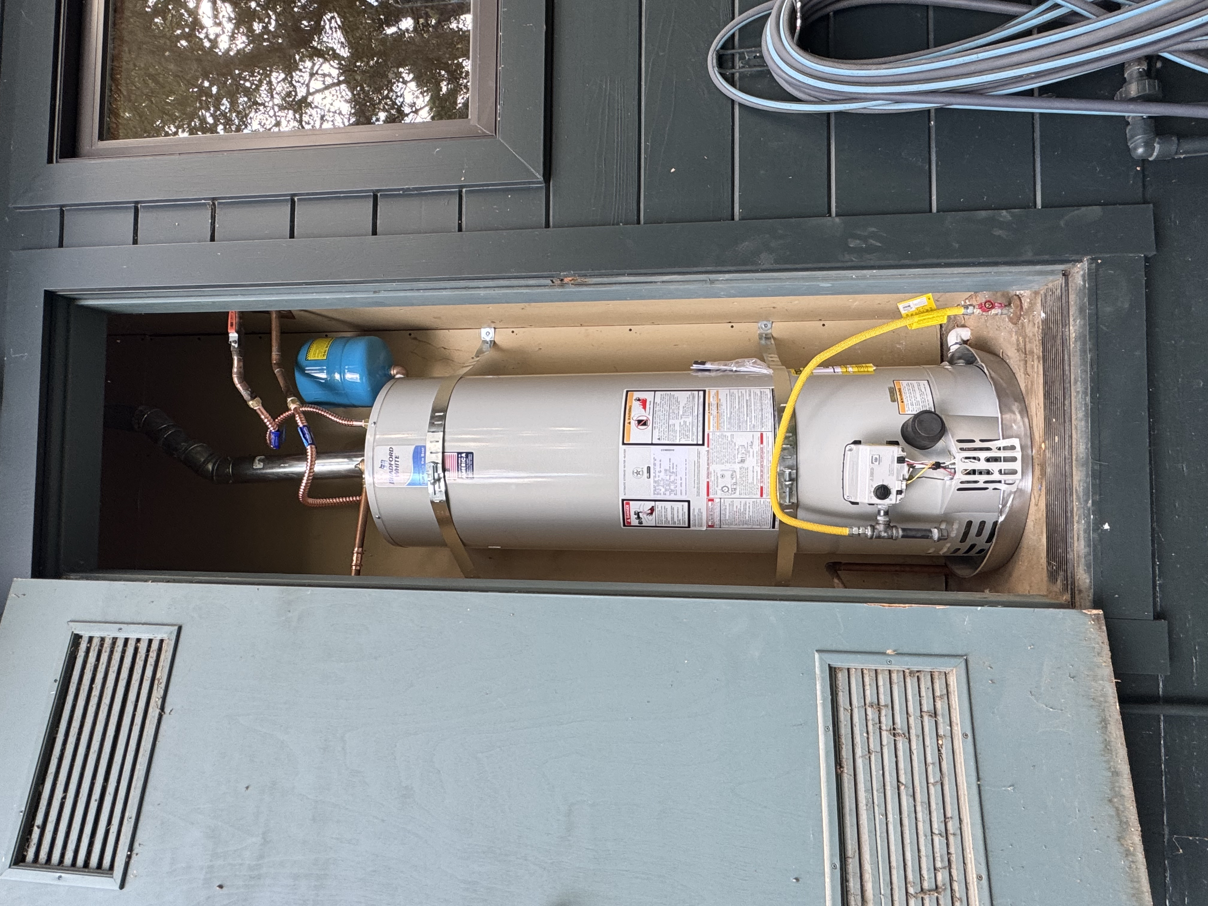 Replacement water heater with thermal expansion tank and gas sediment trap in Mill Valley