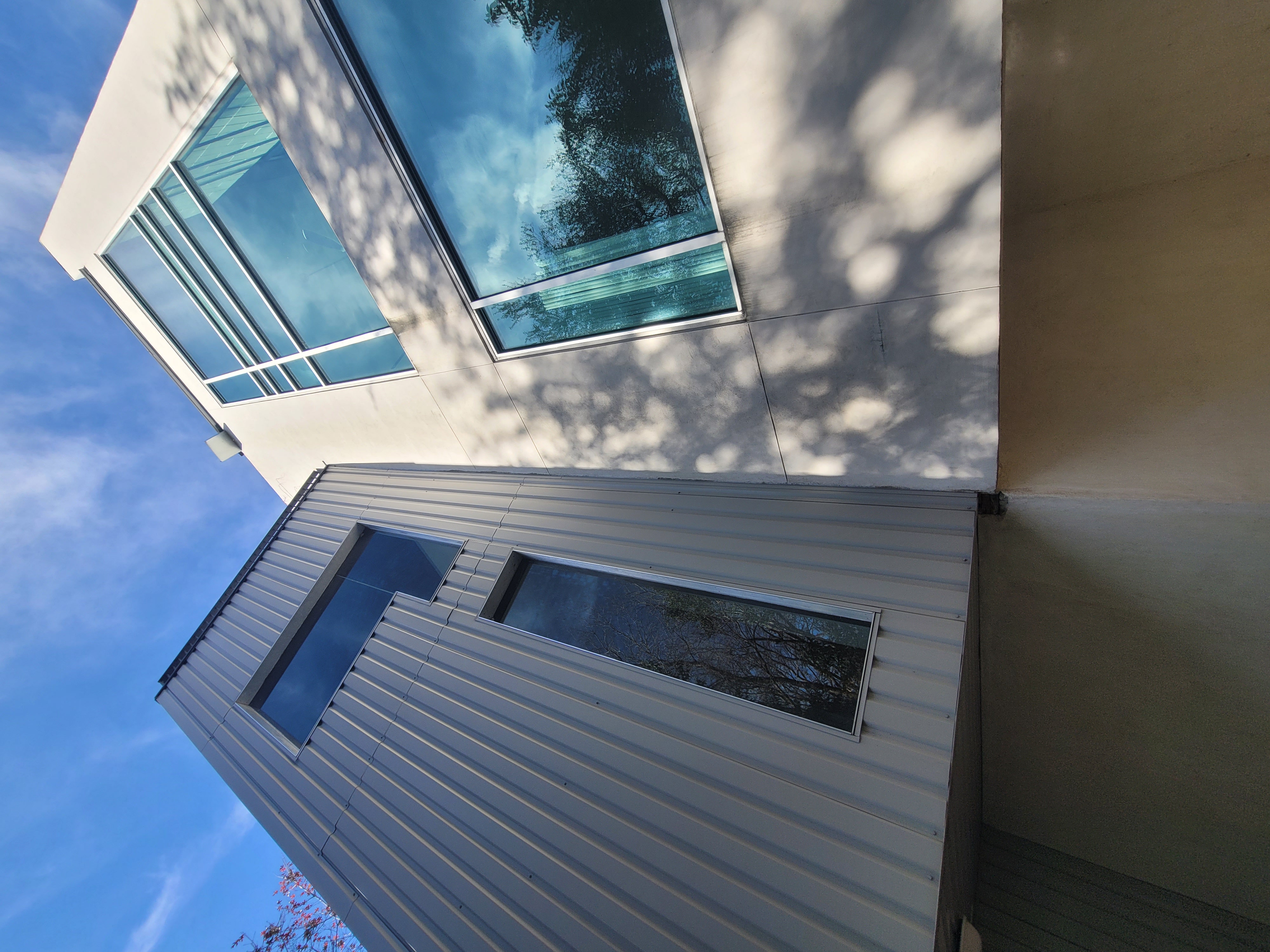 Close view of clean exterior wall meeting clean windows on an Austin home