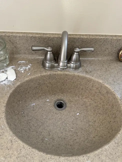 We restored smooth drainage in a residential bathroom sink, enhancing both functionality and aesthetics.