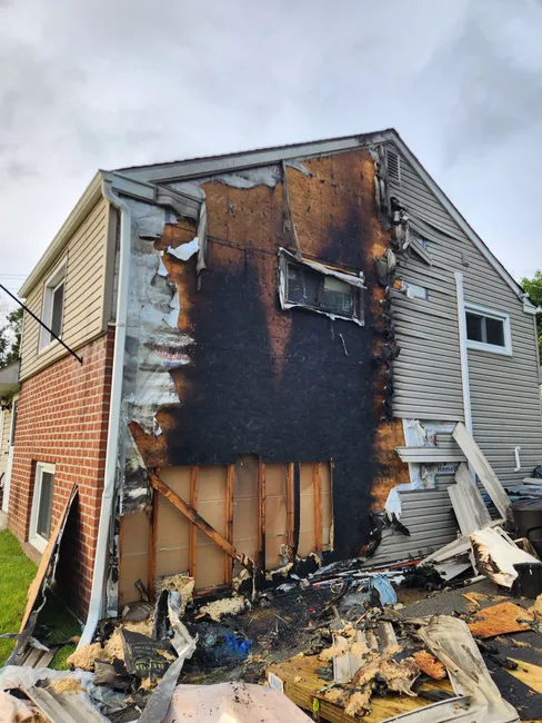After a fire damage from improperly disposed fireworks, we restored safety and livability through careful cleaning and siding replacement.