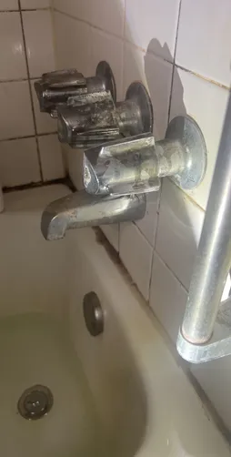 photo at Spring, TX on Dec 27, 2025: A leak was identified in the three-handle faucet of the second-floor shower bath tub, along with an