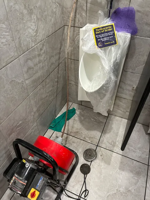 Persistent backups in a commercial restroom were resolved with our snake machine, restoring proper drainage efficiently.