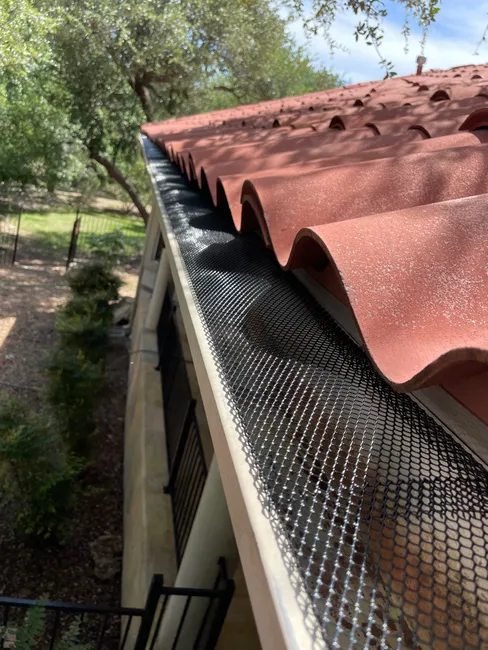 In a Driftwood residence, we enhanced curb appeal with thorough gutter cleaning and refreshed the pool area for enjoyable outdoor living.