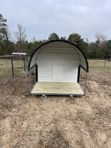 photo at undefined, TX on Dec 22, 2025: 6x8 dog house in brilliant white with black trimsolid flooring, heat, ac, insulation, light, doggy