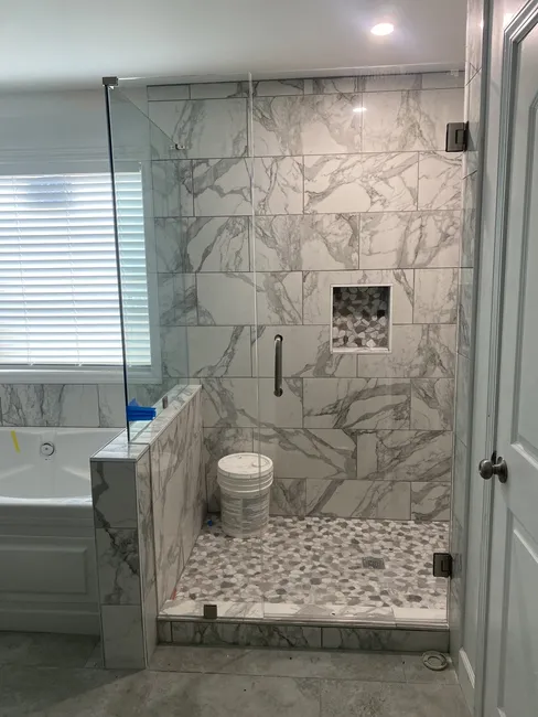 3 Panel Frameless Glass Shower Enclosure with Brushed Nickel Hinges, Clips, and Handle - this has a standard size door with a fixed panel next to it and the fixed glass on the knee wall