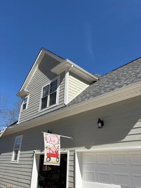 To enhance water drainage, new downspouts were installed and gutters re-leveled for optimal flow.