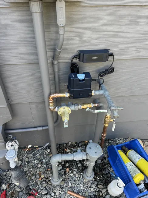 An outdated shutoff valve was replaced with a new 3/4” Moen Smart Flow, enhancing water efficiency in the home.