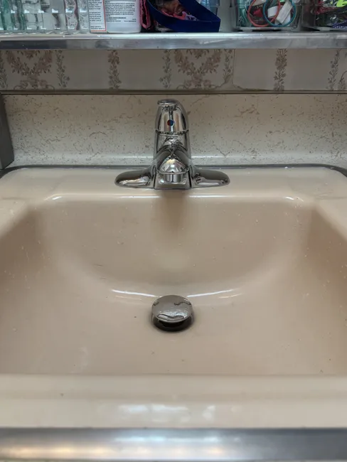 Upgrading the bathroom, we installed a new lavatory faucet and replaced the drain assembly for improved efficiency.