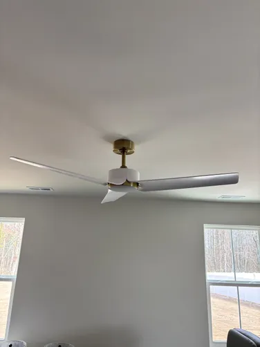 Four outdated ceiling fans in a residential space were replaced with modern, efficient models to enhance airflow and style.