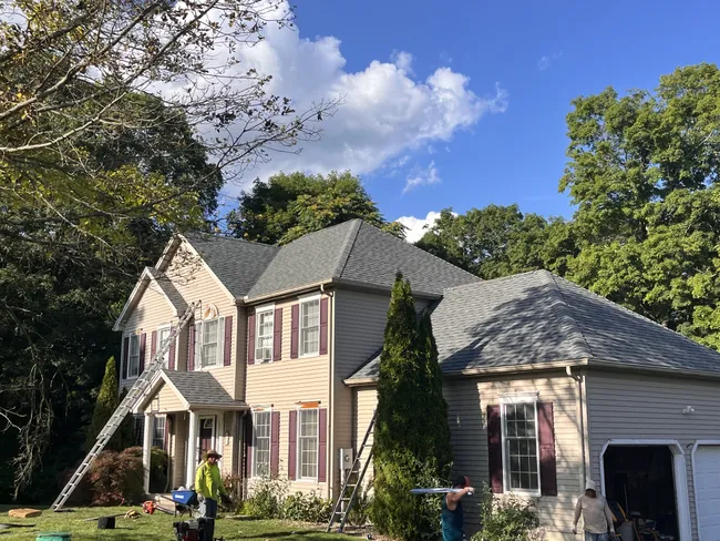 A deteriorating roof led to a complete asphalt replacement in New Milford, enhancing both durability and curb appeal.