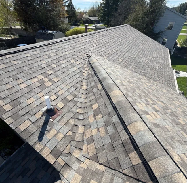 After hail damage compromised the roof and gutters, we restored the exterior, providing the homeowner with a secure and appealing finish at no cost.