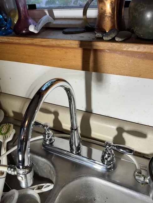 A leaking kitchen faucet was replaced with a stylish, high-quality model, enhancing both function and beauty.