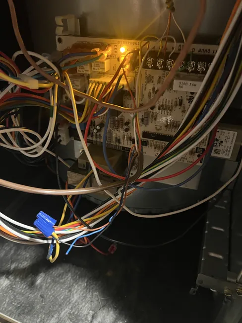 Restored heating at a residential home by replacing a faulty pressure switch and adding a surge protector to enhance system reliability.