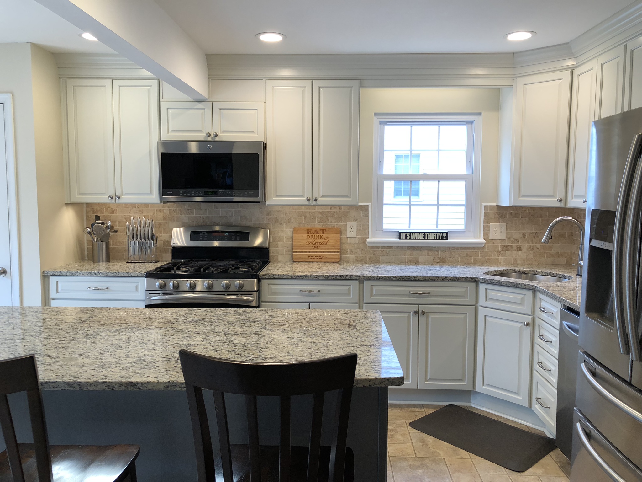 Granite countertops and new backsplash in a remodeled Columbia kitchen