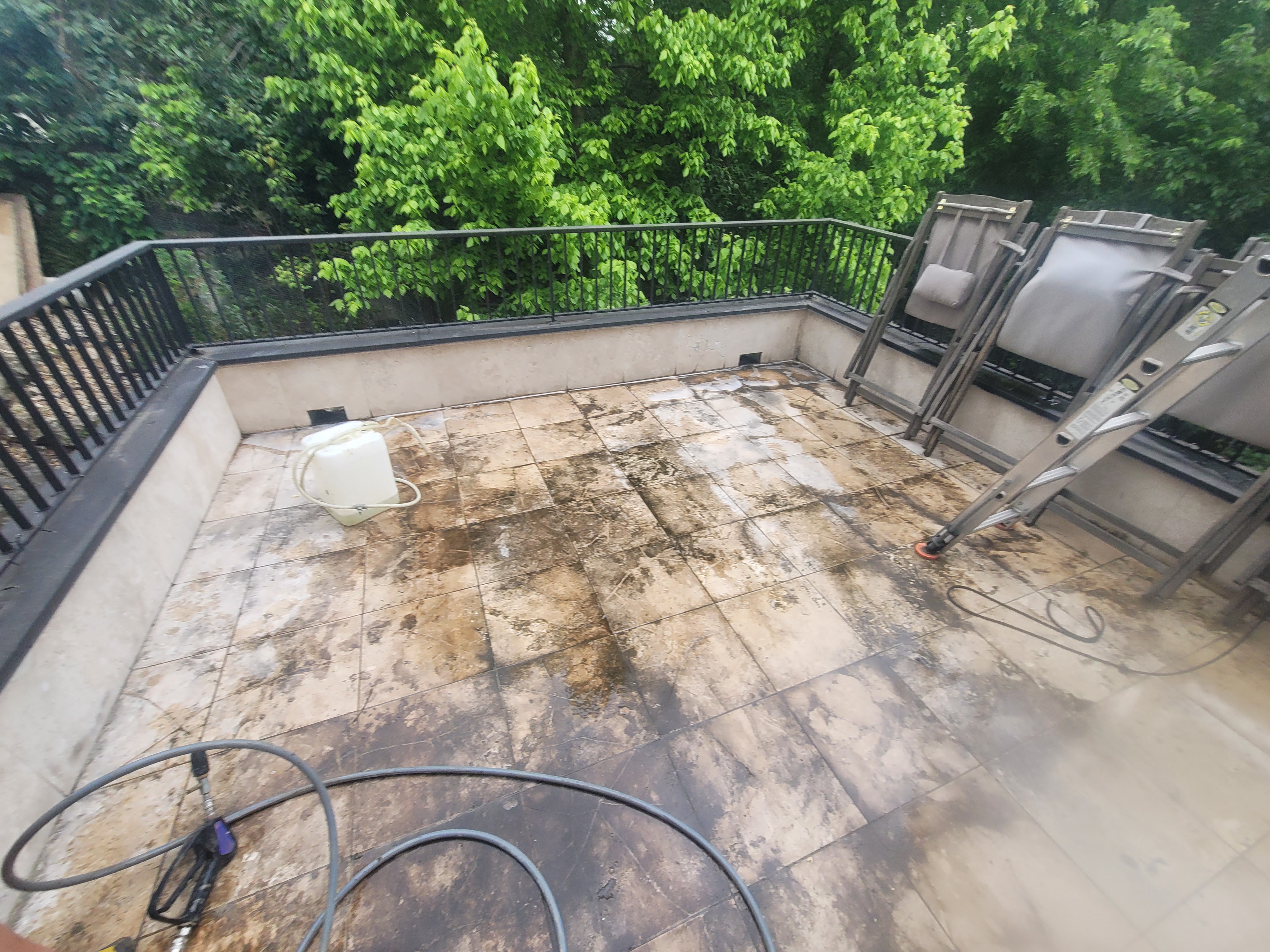 Patio on an Austin job showing a washed section next to an unwashed section