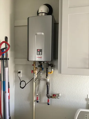 photo at Kerrville, TX on Jan 28, 2026: An interior Rinnai LP tankless water heater located in the laundry room required maintenance, havin photo at Kerrville, TX on Jan 28, 2026: An interior Rinnai LP tankless water heater located in the laundry room required maintenance, havin
