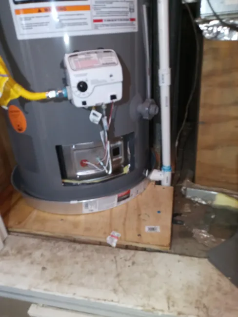A leaking drain valve led us to replace the water heater, fixing the leak and restoring the subfloor's stability.